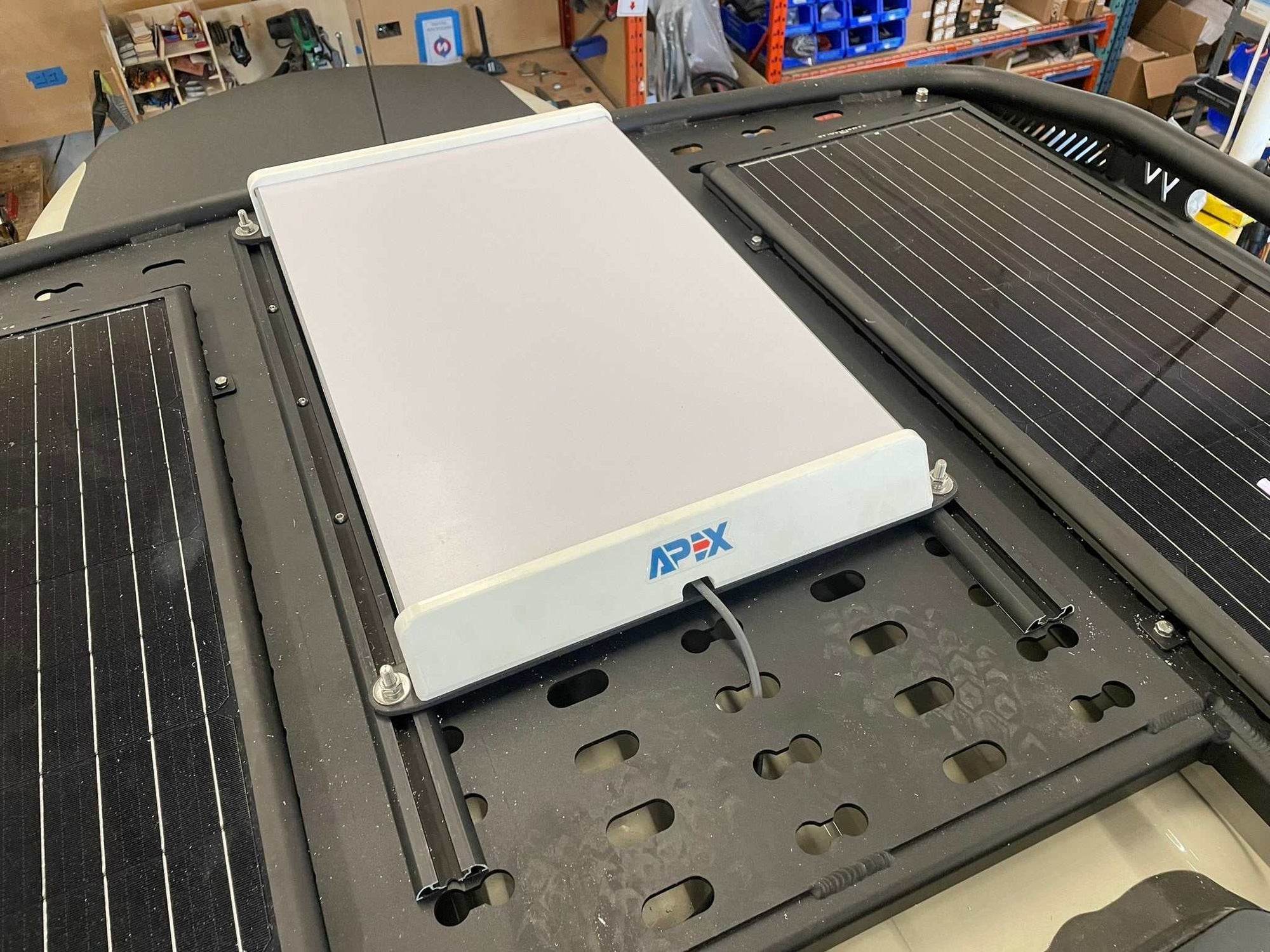 Starlink car mount with APEX Gen 3 antenna on a vehicle roof.