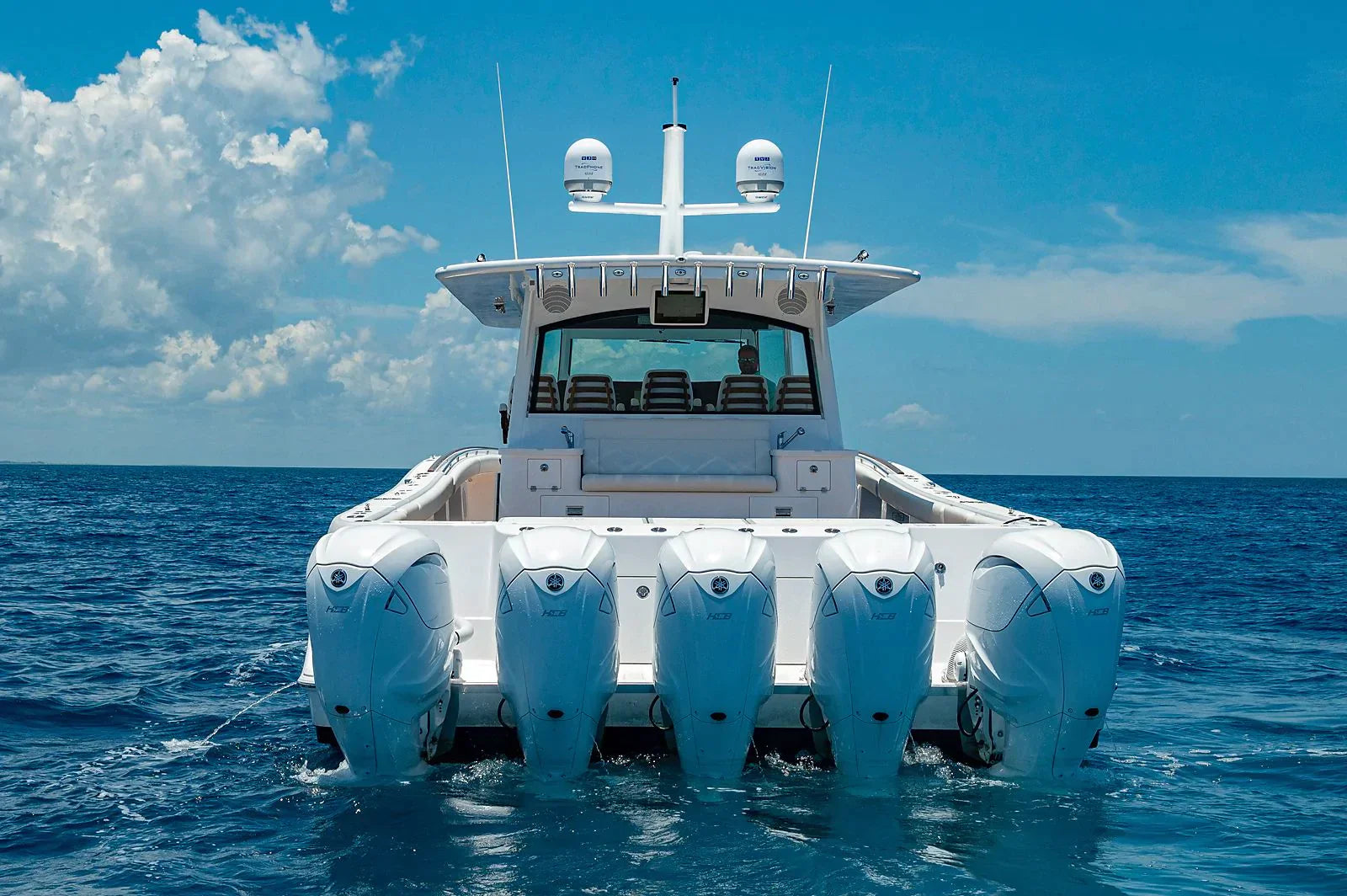 HCB yacht with Seaview Custom Mast and multiple outboard engines on the ocean.