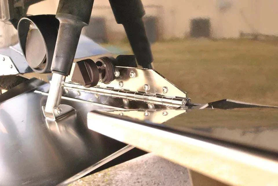 inteliPlug ProX Boat Drain Plug installed on a boat transom with garboard assembly.