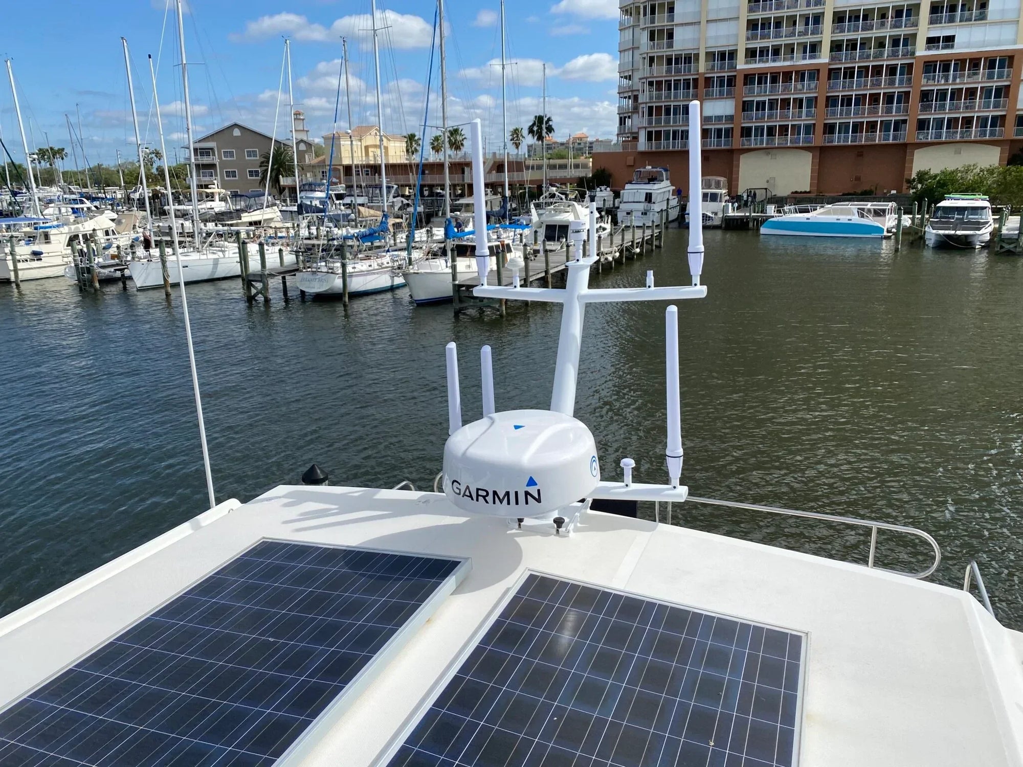 Seaview hinged mast Model #80 with Garmin radar and antennas on a boat docked at a marina.