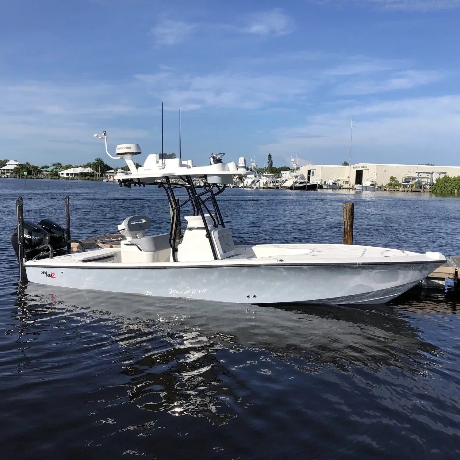 SeaVee boat equipped with Seaview marine electronic mounts, docked at a marina.