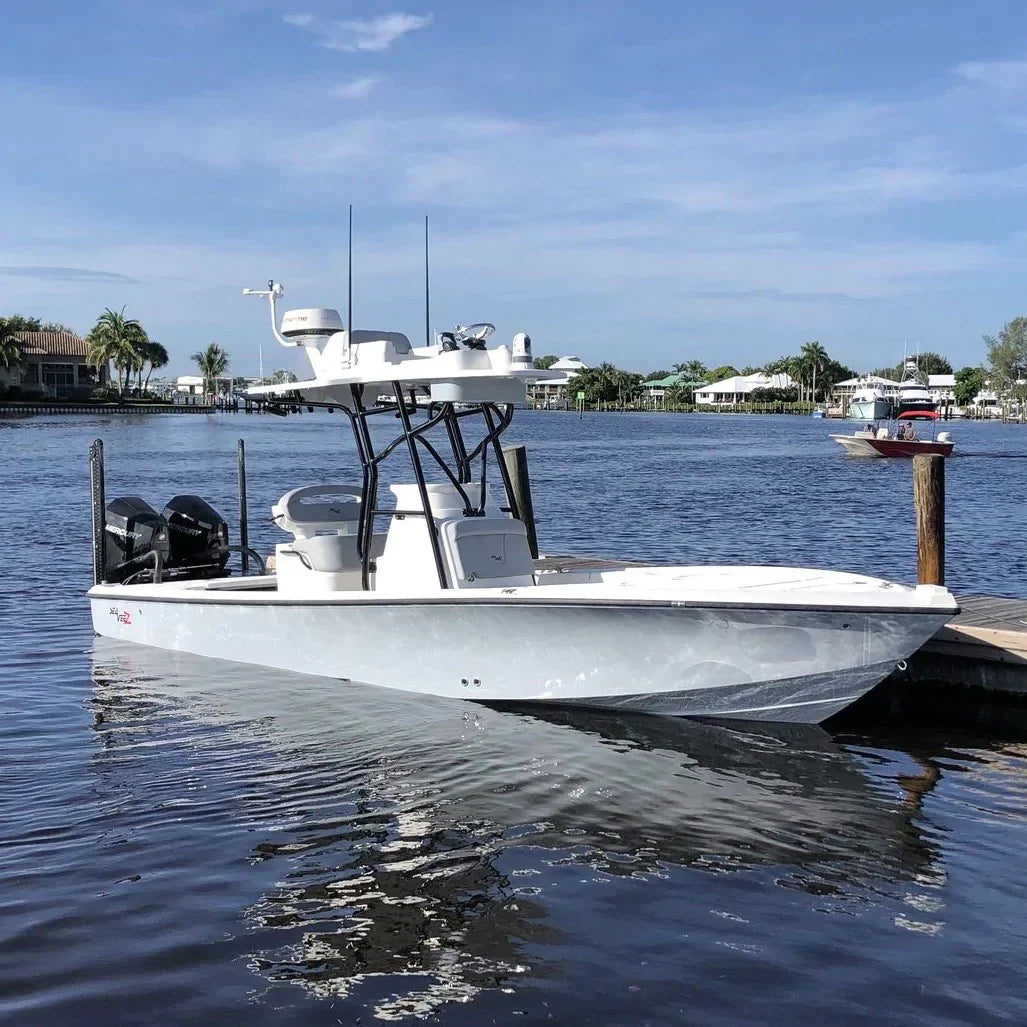 SeaVee boat with Seaview mount docked on a tranquil waterway.