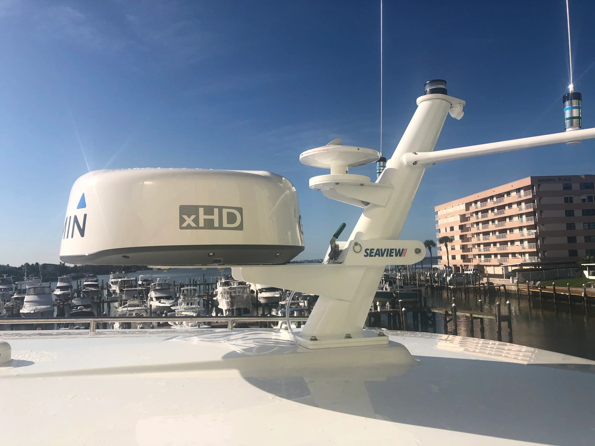 Seaview custom mast with communication equipment on a yacht rooftop.