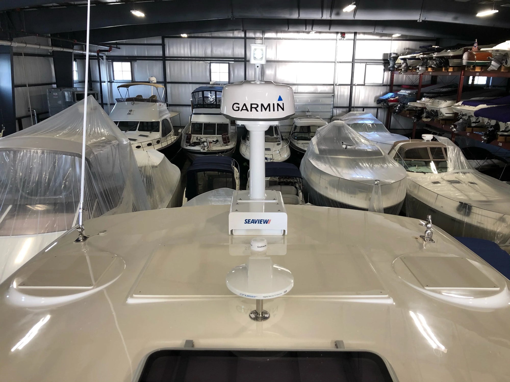 Boat with Seaview and Garmin equipment in warehouse.