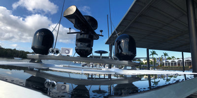Custom black double radar mast for Riviera Yachts. Furuno open array, Furuno closed dome, SC33, Navigation lights, weather station.