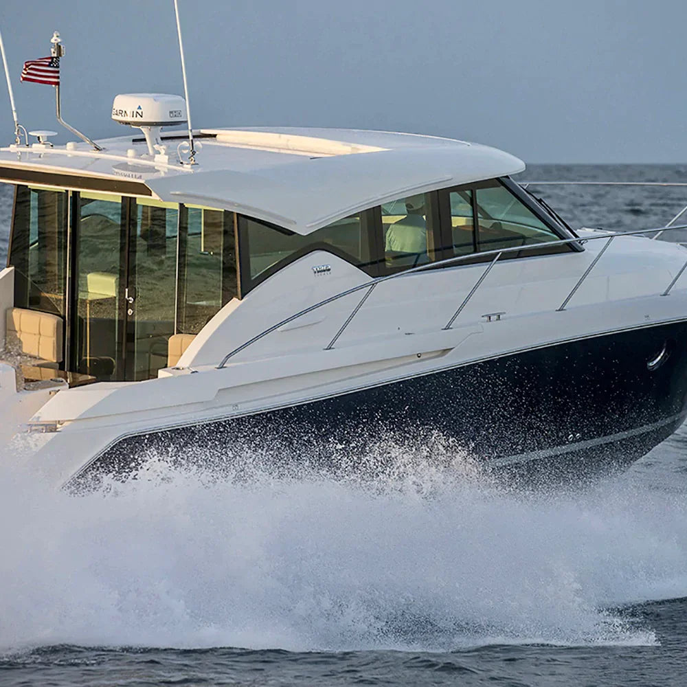 Tiara Yacht with Seaview radar mount cruising on open water.
